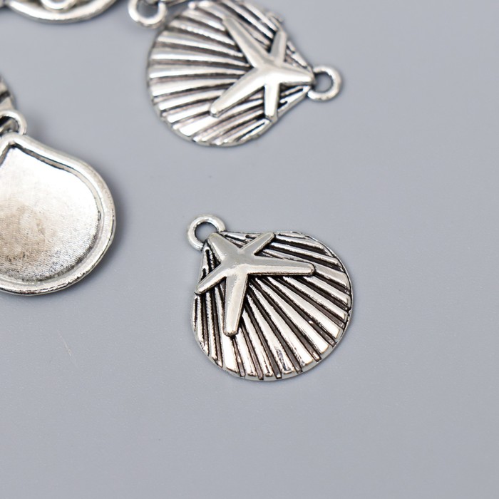 Декор металл для творчества "Ракушка гребешок со звездой" серебро G192B766 2,2х1,8 см
Декор металл для творчества "Ракушка гребешок со звездой" серебро G192B766 2,2х1,8 см