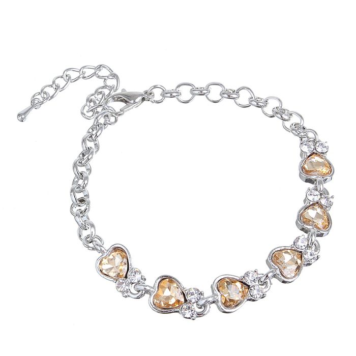 Браслет со стразами "Сердечки", цвет янтарный в серебре