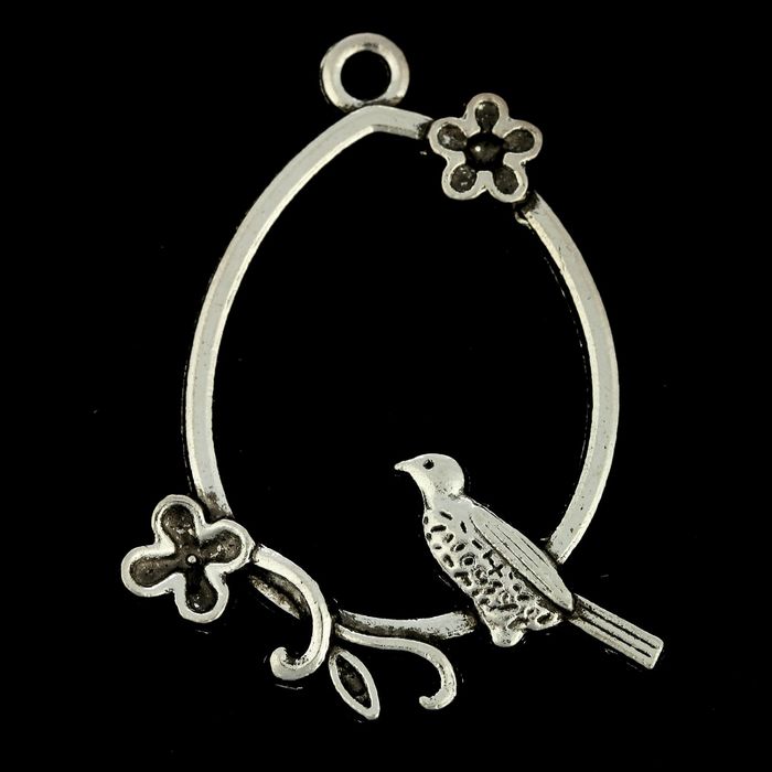 Декоративный элемент "Птица в овале"