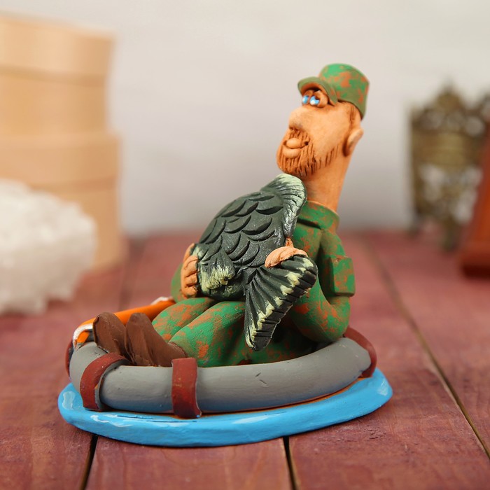 Статуэтка "Рыбак в лодке с карпом"