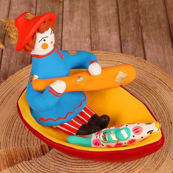 Дымковская игрушка "Ммужик в лодке"