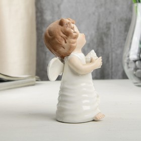 

Сувенир керамика "Ангел-малыш в платье со звездами, с ракушкой в руке" 10,5х5,9х6,3 см