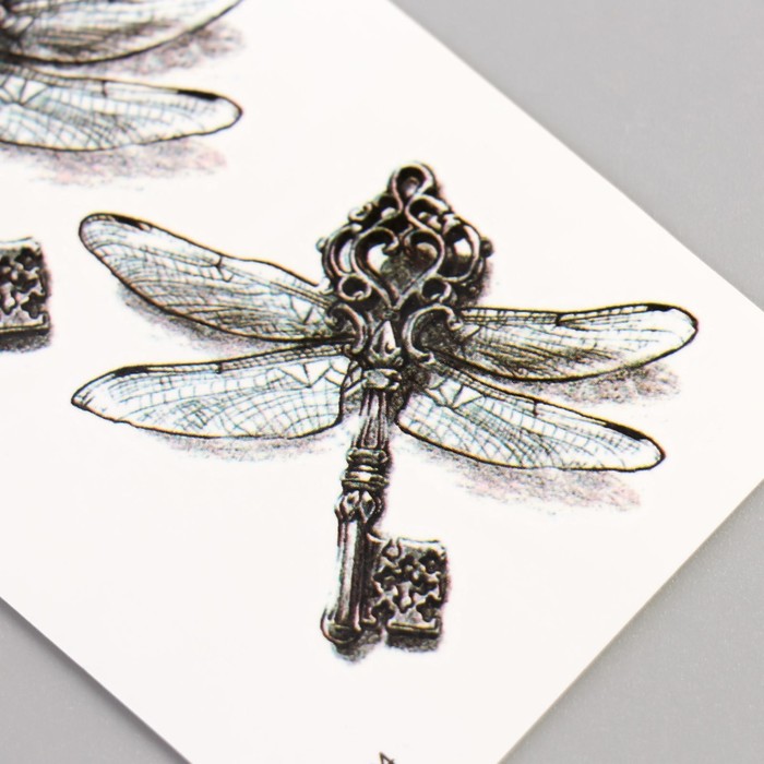 фото Татуировка на тело чёрная "стрекоза-ключ" 10,5х6 см