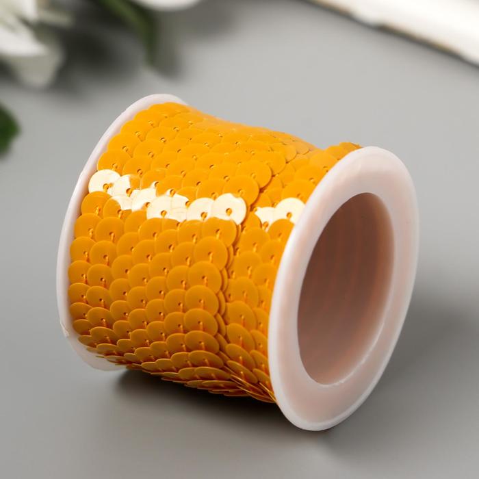 фото Нить из пайеток на бобине "кругляши пастель жёлто-оранжевые" намотка 5 метров d-0,6 см арт узор