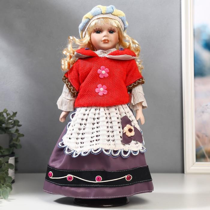 Кукла коллекционная керамика "Блондинка с кудрями, алый свитер с цветочками" 40 см