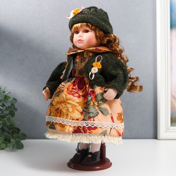 Кукла коллекционная керамика "Алёна в платье с цветами, в зелёной шапке и джемпере" 30 см