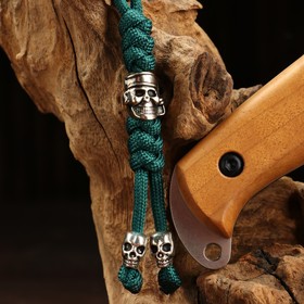 

Темляк для ножа, с бусиной череп, зеленый