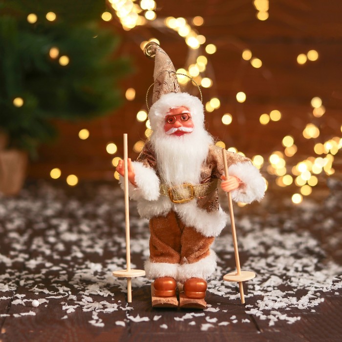 цена Дед Мороз В блестящем костюмчике, на лыжах 16 см, золотисто-белый