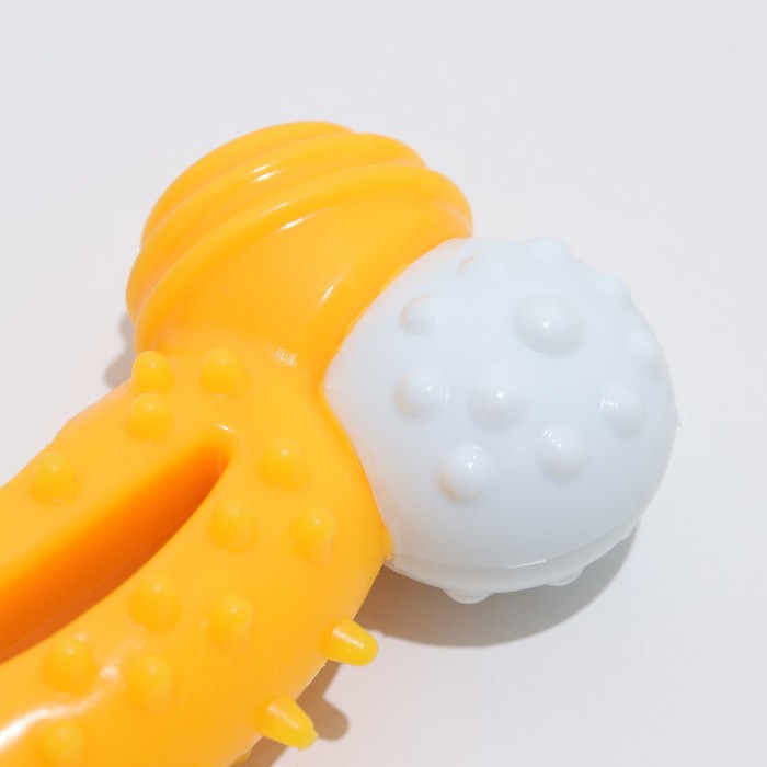 Игрушка двухслойная (твердый и мягкий пластик) "Изогнутая кость", 13 см желтая