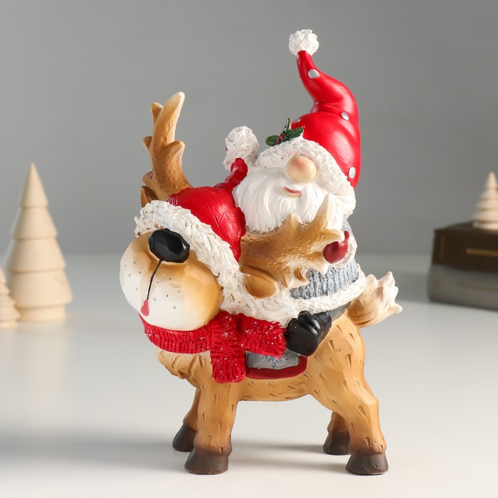 Сувенир полистоун Дед Мороз верхом на олешке в красном колпаке и шарфике 8х14х23 см