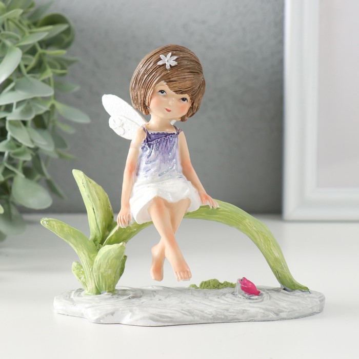

Сувенир полистоун "Малышка в сиреневом платье с крыльями, сидит у пруда" 12,5х8х12 см