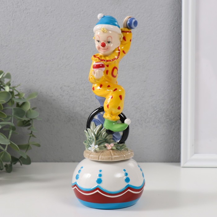 Сувенир керамика музыкальный Клоун жонглирует сидя на колесе 8,5х8,5х22 см цена и фото